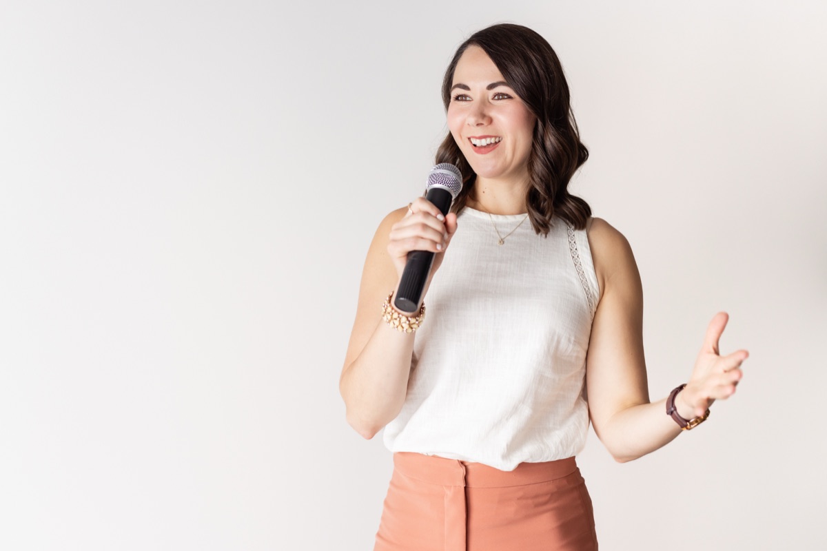 Brittany speaking with microphone