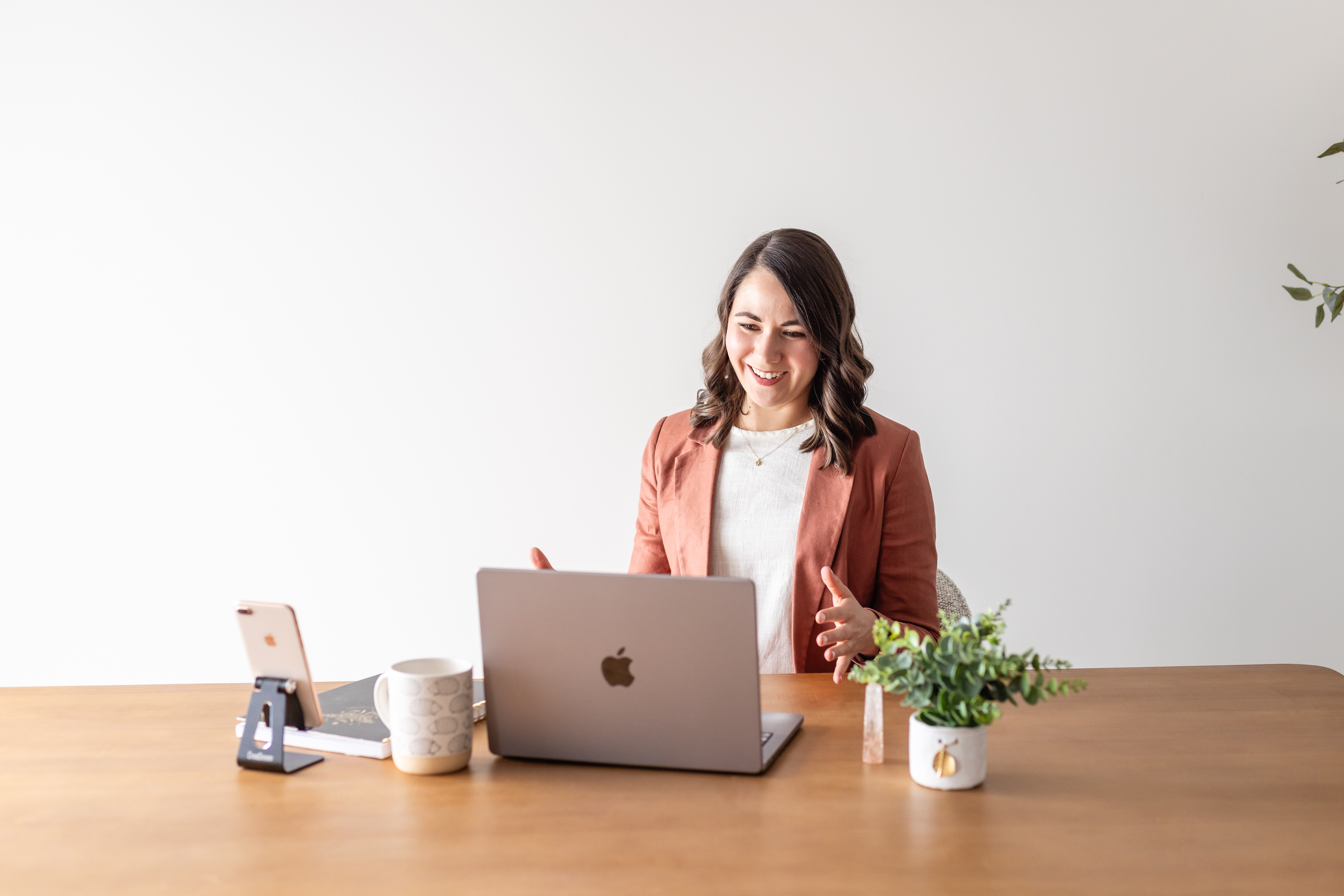 Brittany on a video coaching call, laughing and gesturing