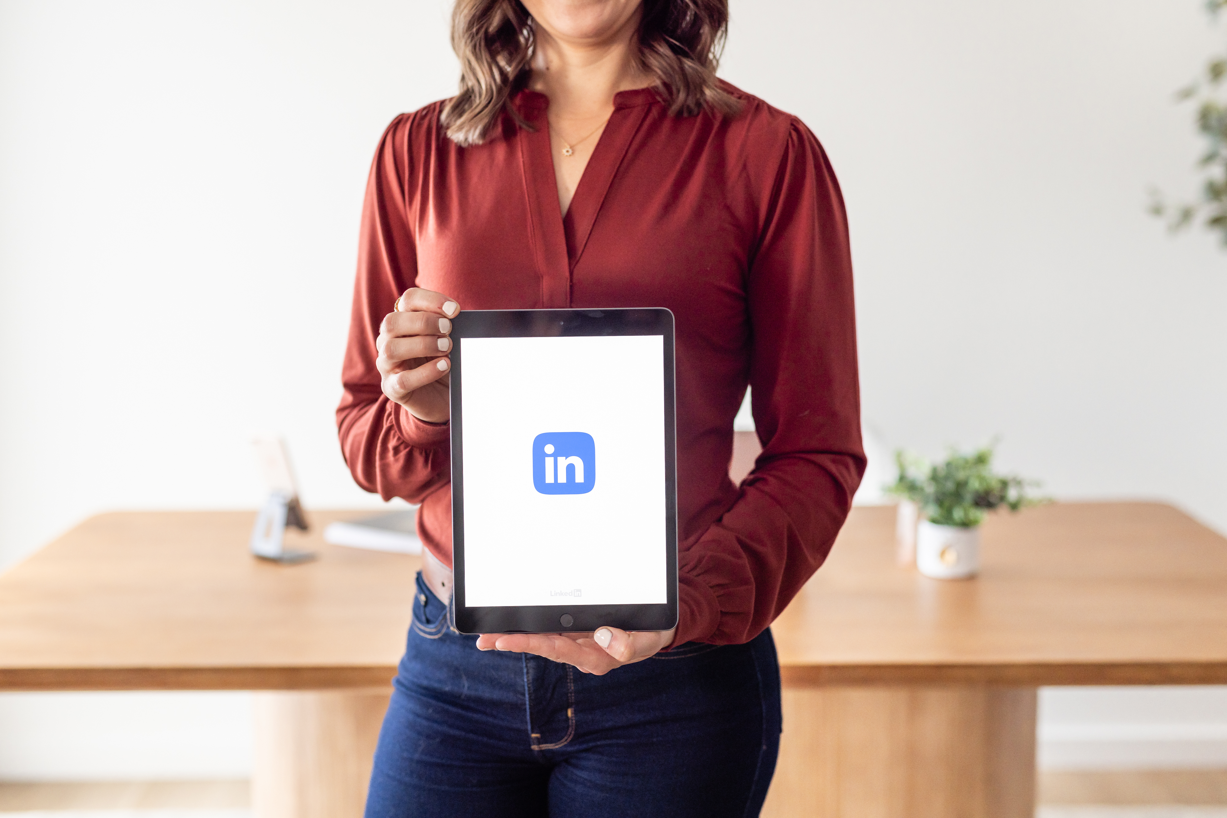 Brittany holding LinkedIn tablet — LinkedIn Business Growth Academy