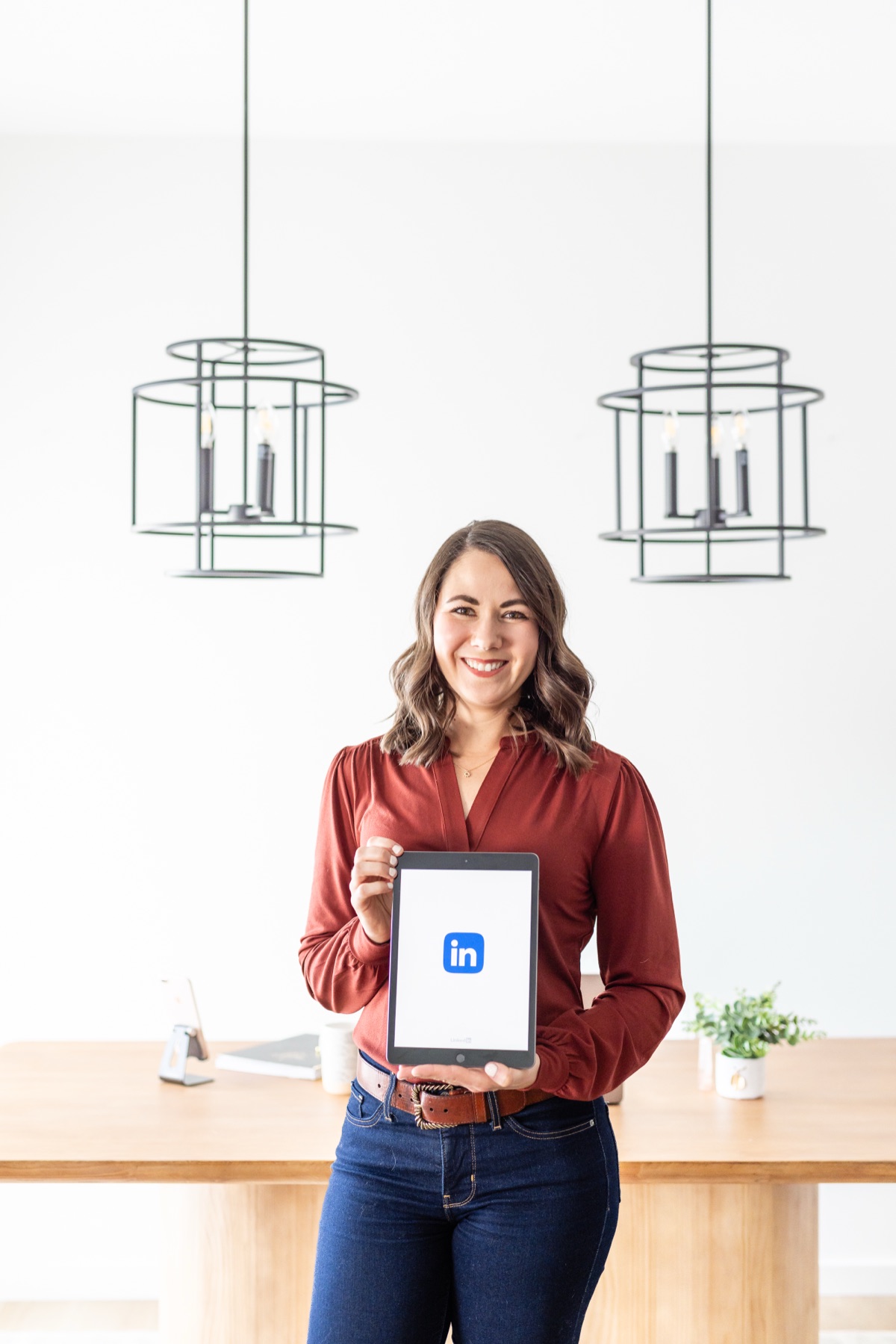 Brittany holding LinkedIn tablet